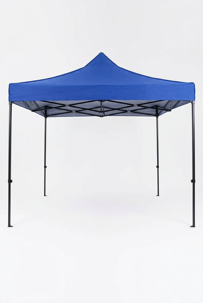 A blue pop-up canopy tent with black metal support frames is set up in a parking lot, with a black Volkswagen car parked underneath it.